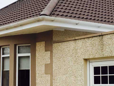 Roofing facia, white around corner of building