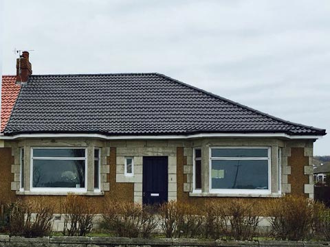 Charcoal roof with black gutters