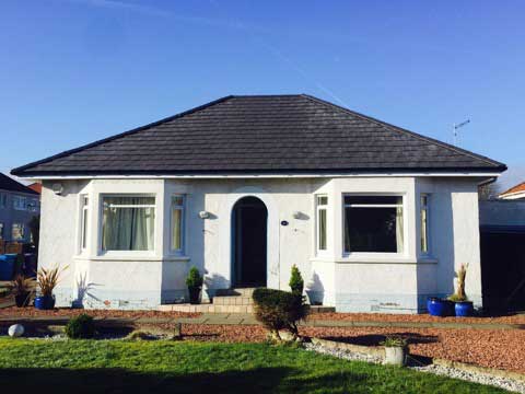 Charcoal roof on white house